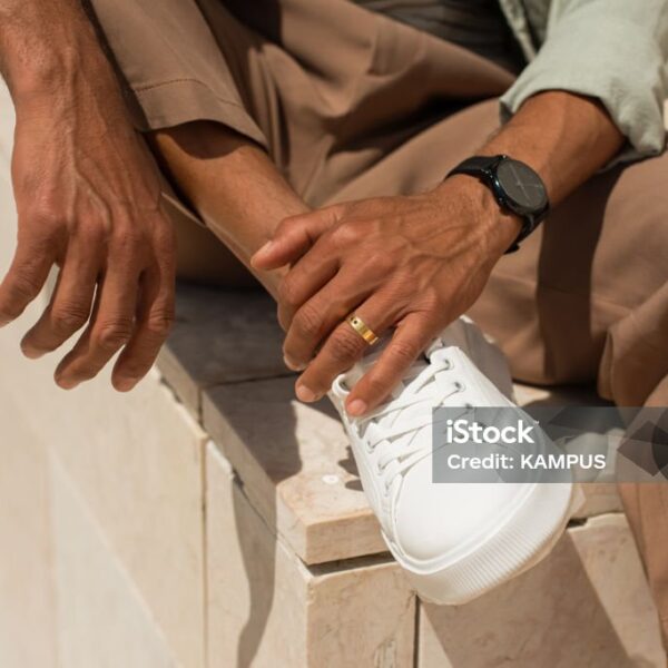 Close-up of African American man hands. Male hands with ring and watch. Stylish Black man concept